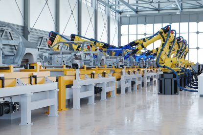 Robotic automotive assembly in factory.